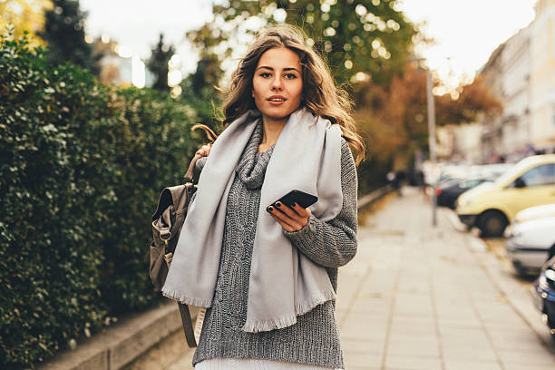 istock Woman texting outdoors 639186218