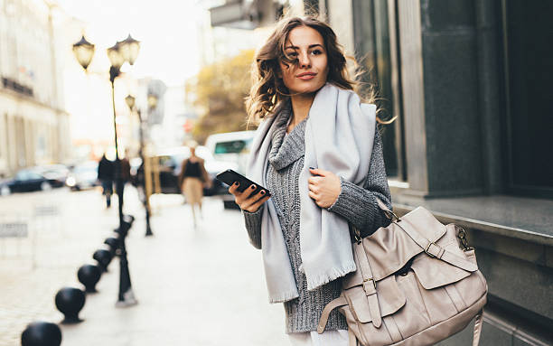 istock Woman texting outdoors 639186250