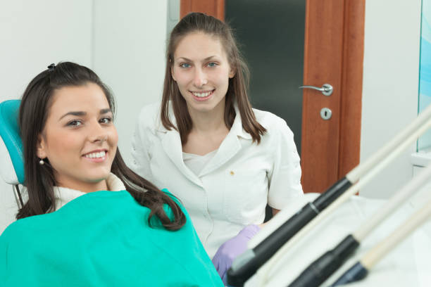 istock Dentist examining a patient's teeth in the dentist 639187646