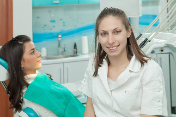 istock Dentist examining a patient's teeth in the dentist 639187714