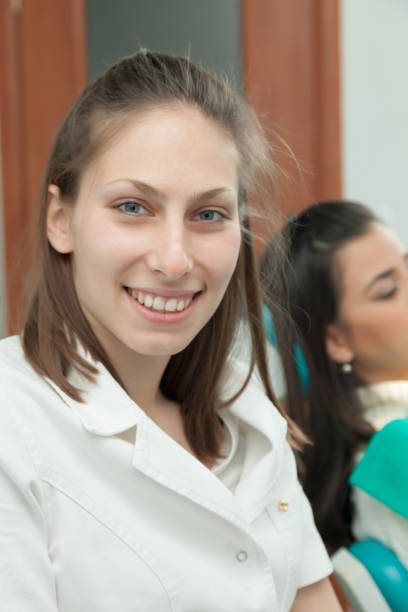istock Dentist examining a patient's teeth in the dentist 639187840