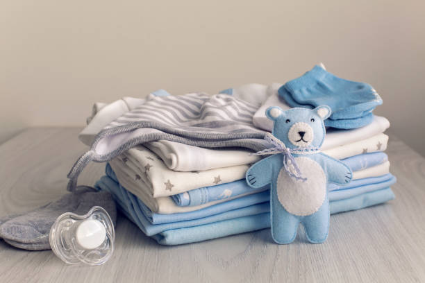 istock baby clothes with diapers are stacked 639192354
