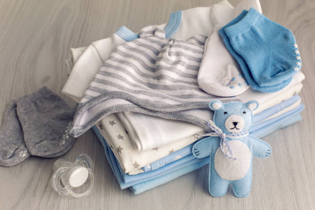 istock baby clothes with diapers are stacked 639192396