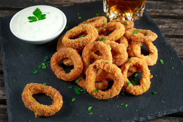 istock Fried Breaded Onion Rings with sauce and beer 639192658