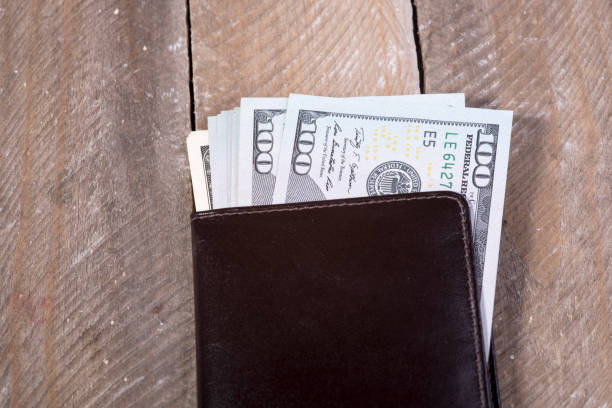 istock wallet full of dollars 639192680