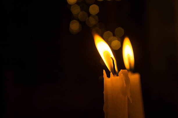 istock Lighting a candle in the night 639195304