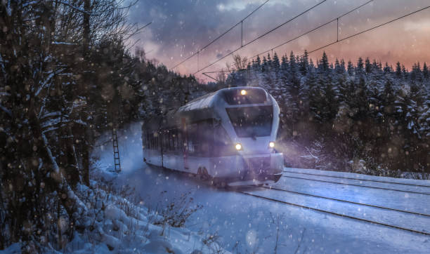 istock train speeding in a snowy winter night 639198574