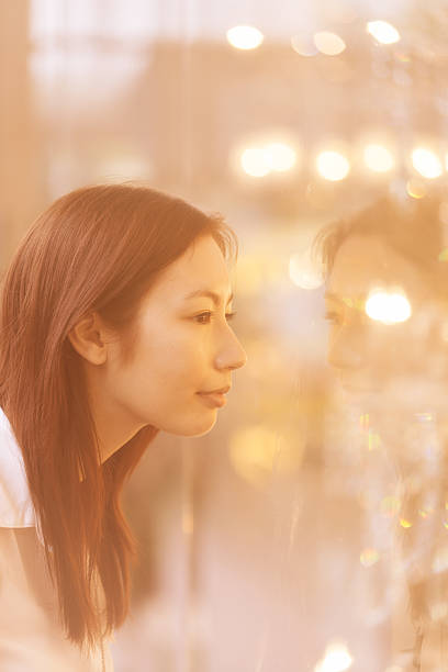 istock Asian woman looking at display case 639198852