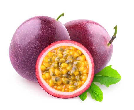 Isolated maracuya. Two whole passion fruits and a half isolated on white background with clipping path