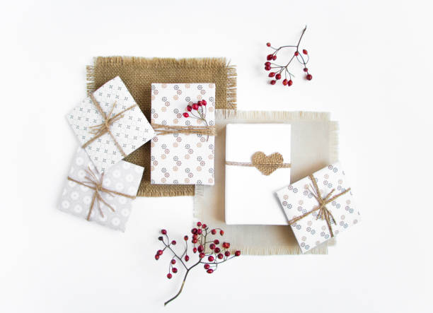 istock Rustic handmade gifts on white background with berries. Top view 639204800