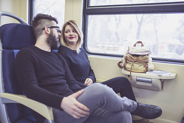 istock Happy couple traveling by train 639204940
