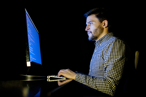 Vcin Computer Software Developer Computer At Dark Home Office Stock Photo - Download ...