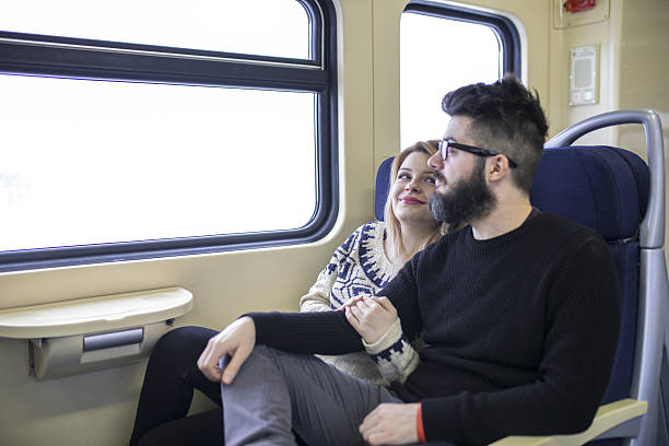 istock Happy couple traveling by train 639206932