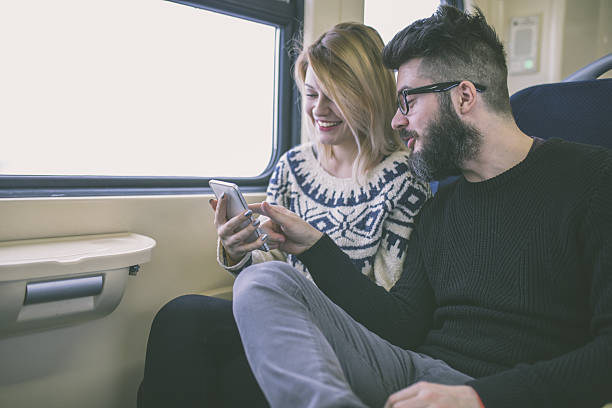 istock Happy couple traveling by train 639207094