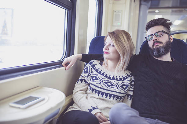 istock Happy couple traveling by train 639207670