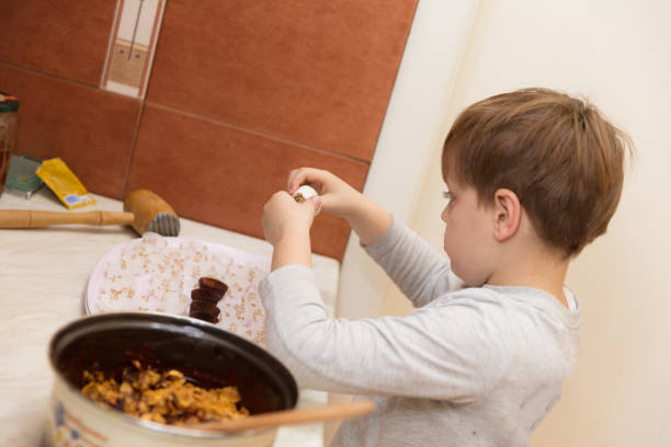 istock Little boy making cookies 639208774