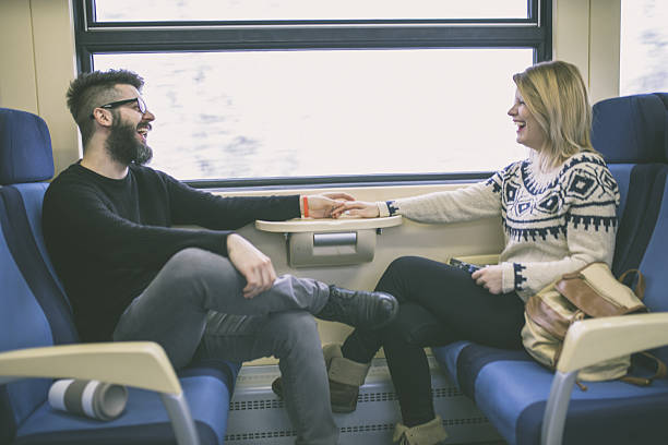 istock Happy couple traveling by train 639208862