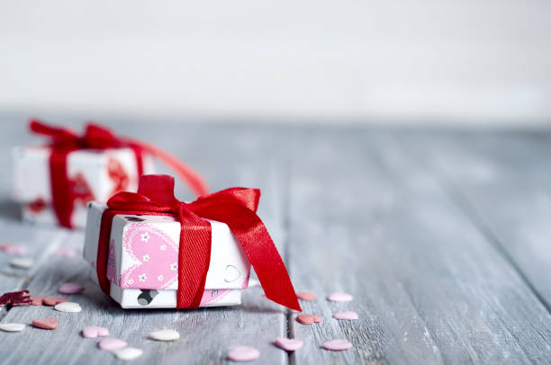 istock Gift box with hearts on wooden table for Valentines day 639210264
