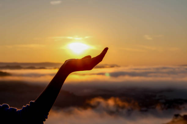 istock The sunrise in hand on mist background 639211402