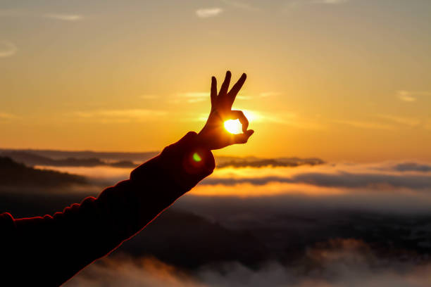 istock The sunrise in hand on mist background 639211426