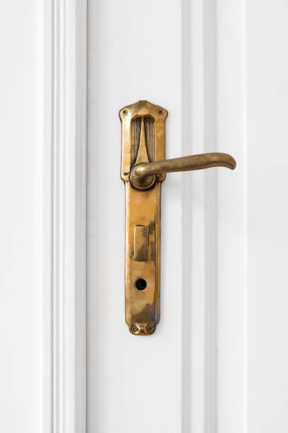 istock old door handle  on white door 639213748