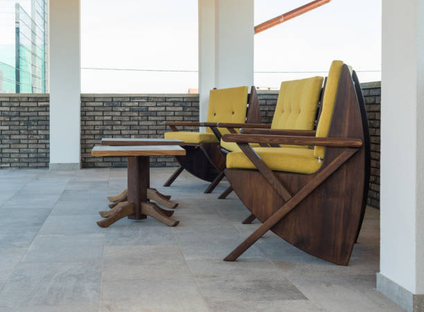 istock Armchairs on open terrace in luxury villa exterior 639214092