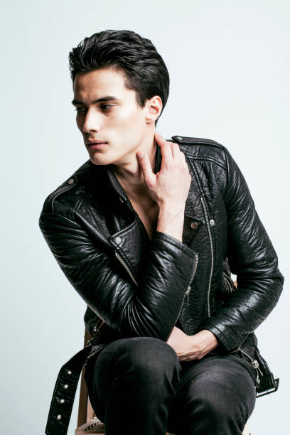 istock young handsome man, leather jacked on naked torso, emotional posing 639216890