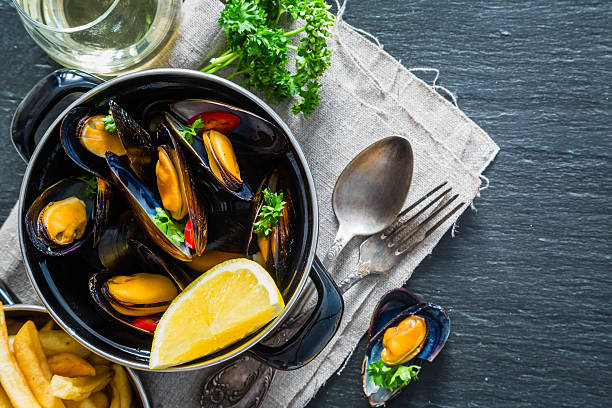 istock Mussels in pan on rustic background 639217170
