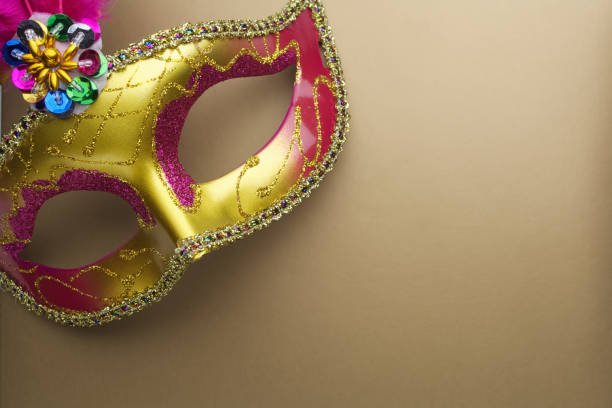 istock Colorful mardi gras or carnivale mask on a gold background 639217638