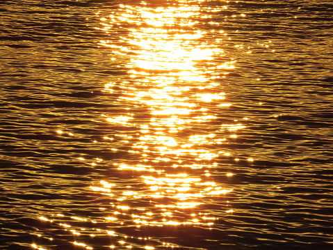 Sunlight over sea with brighting spots