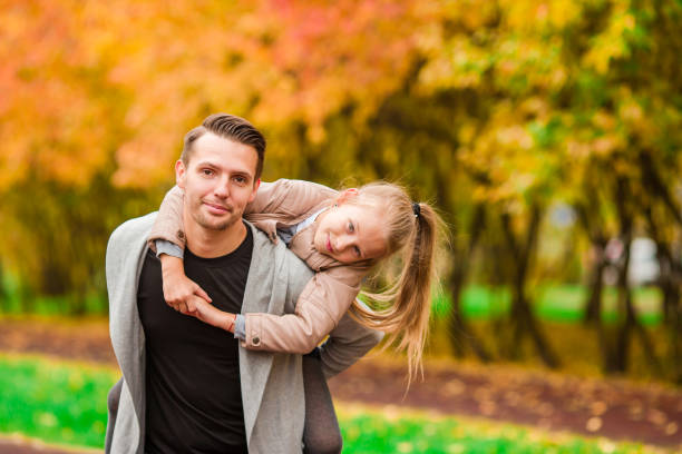 istock Happy family having fun on autumn day 639219496