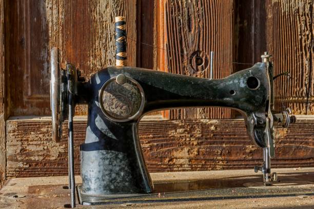 istock Forgotten black retro sewing machine in abandoned old house. 639219598
