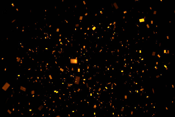 istock falling gold sparkle glitter foil confetti, on black background 639224794