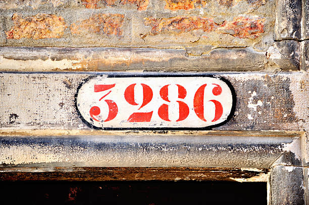 istock House number and worne wall 639225820