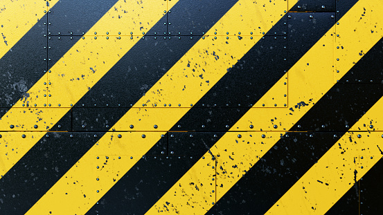 A collection of rugged scratched plates, with danger stripes painted on. Bolted together with rivets. The image has an 16:9 aspect ratio.