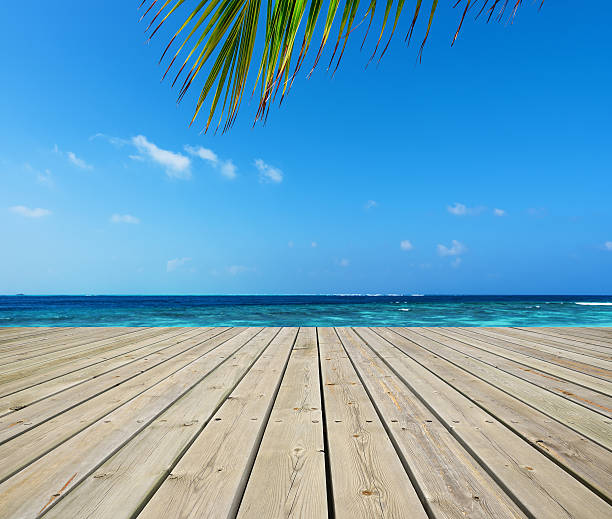 istock Wooden platform beside tropical sea 639226154