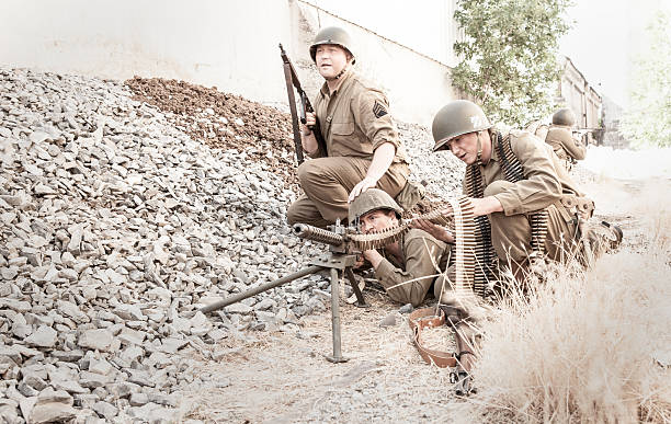 istock Soldiers at ready with a 30 cal machine gun WWII 639228388