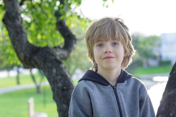 istock Portrait of a boy playing in a tree 639228918
