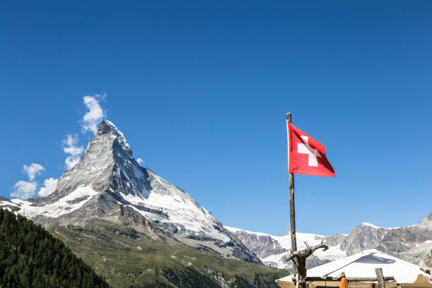 The Matterhorn and the Swiss flag stock photo