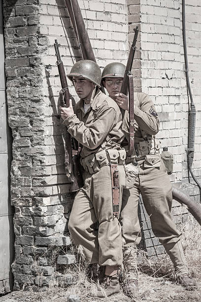 istock Soldiers ready to enter a building WWII 639232208