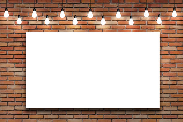 istock Blank white frame on brick wall with bulb lights lamp. 639233976