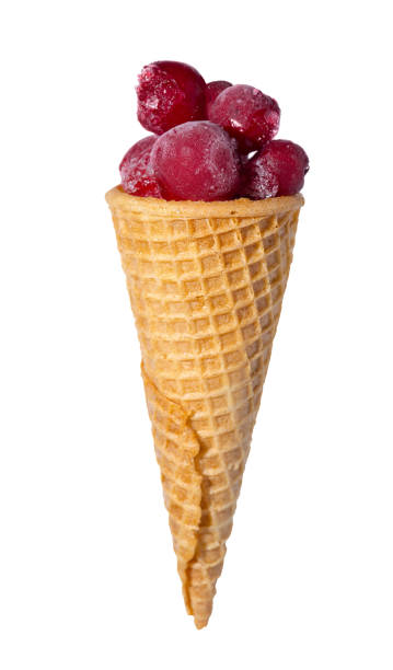 waffle cone with frozen cherry berries isolated on white background, close up, concept of juicy ice cream