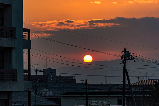 Sunset over city in Japan, wief of traditional asian architecture