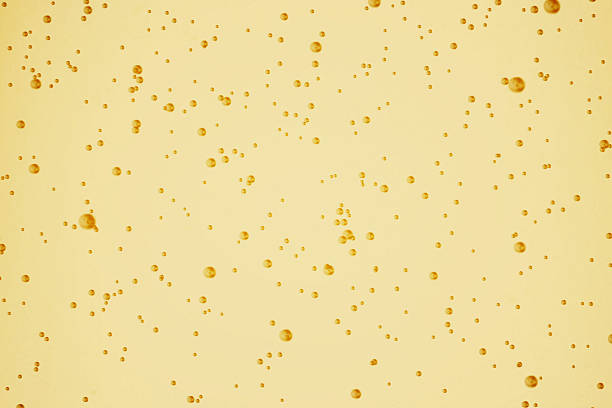 istock champagne golden bubbles inside a flute, gold background effect, holiday 639239402