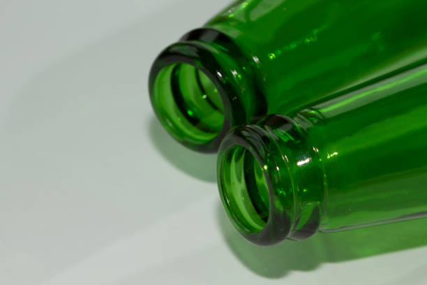 istock Empty green beer bottle necks on white background 639239544