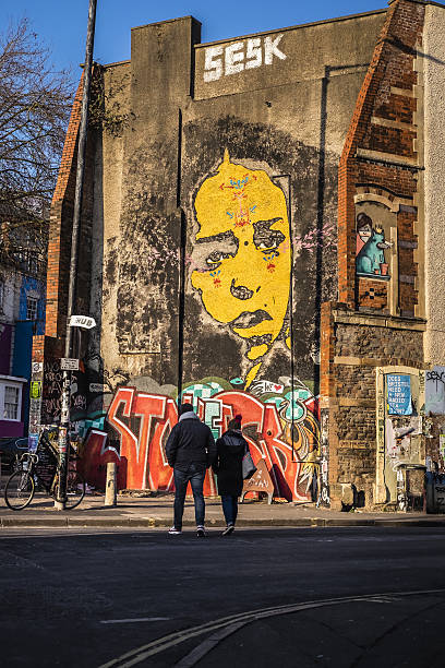 Many graffiti on a residential wall. *** The artwork was digitally superimposed and a release is provided ***