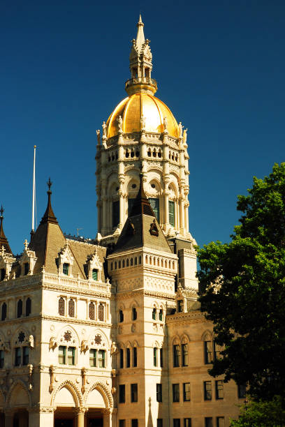 Connecticut State Capitol The Gold Dome of the Connecticut State Capitol shines against the blue sky in Hartford, CT connecticut state capitol building stock pictures, royalty-free photos & images