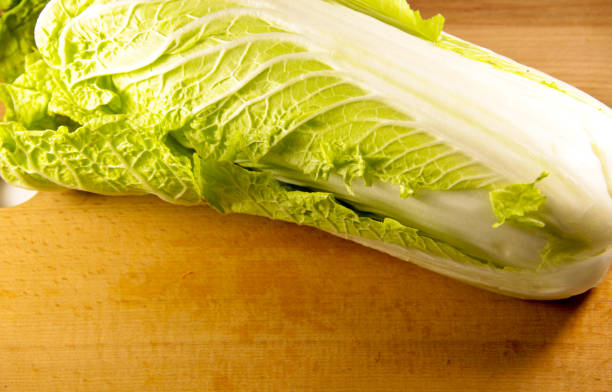 istock Chinese cabbage on a wooden kitchen board 639247250