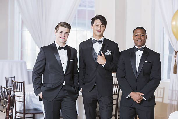 three young men wearing tuxedos - smoking imagens e fotografias de stock