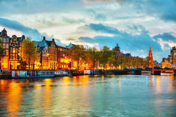 Amsterdam city view with Amstel river at sunset
